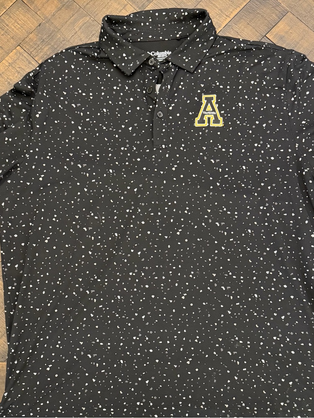 Appalachian State Columbia Black Polo w/White Speckle & Yellow 'A' Logo